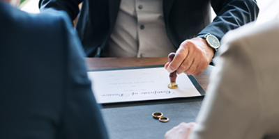 Lawyer with Divorce certificate and couple